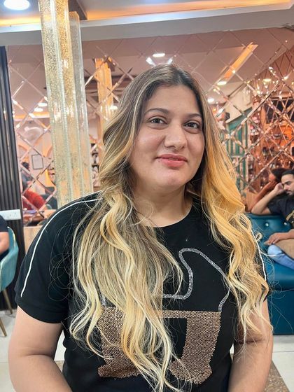 The same client, showing her confidence in her new hair. We love seeing our clients leave with a smile.