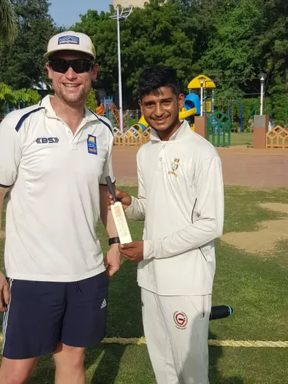 The smile on my player's face says it all. Playing against and learning from international cricketers is an unforgettable experience.