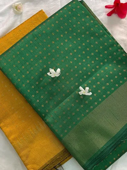 A shot of our semi raw silk sarees in both green and yellow, showcasing the vibrant color options available.