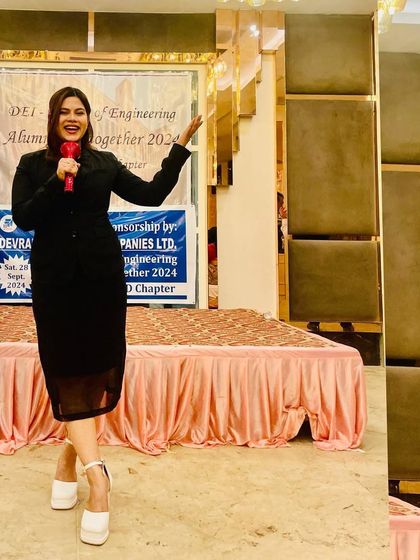 On stage at the alumni meet. My role is to keep the event moving, from speeches and awards to interactive sessions.