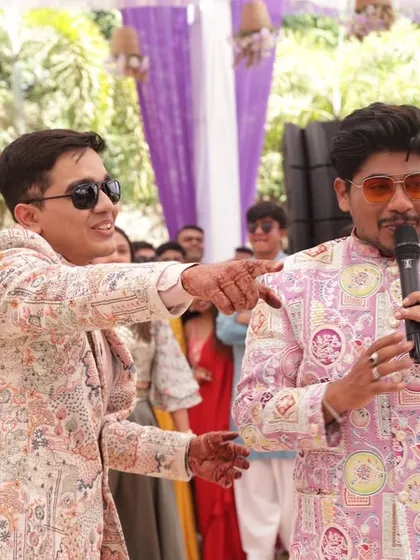 Interacting with the groom during a colorful Haldi ceremony. The vibrant decor and happy faces make these daytime events so special to host.