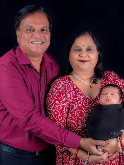 The pride and joy of grandparents holding their newborn grandchild. These multi-generational photos are precious heirlooms for the entire family.