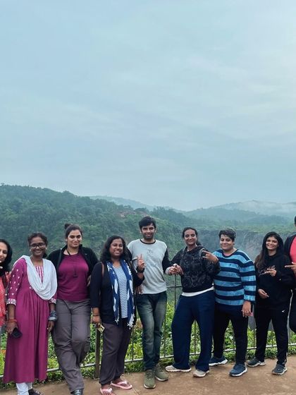 A happy group photo from our Gokarna trip, with the misty coastline in the background.