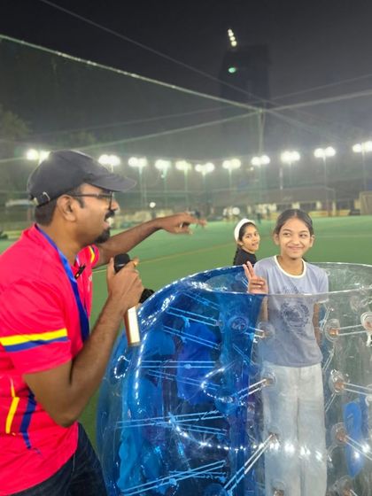 A coach explains the rules of Zorb ball soccer. This hilarious and high-energy game is a party favorite that guarantees lots of bumping and laughing.