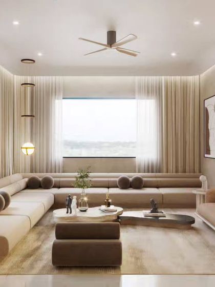 Two views of a minimalist living room with a large, modular sofa. The focus here is on the soft, neutral color palette and the abundance of natural light, creating a feeling of spaciousness and tranquility.