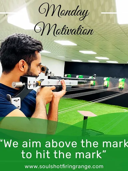 A motivational shot of a shooter taking careful aim with an air rifle. We aim above the mark to hit the mark.