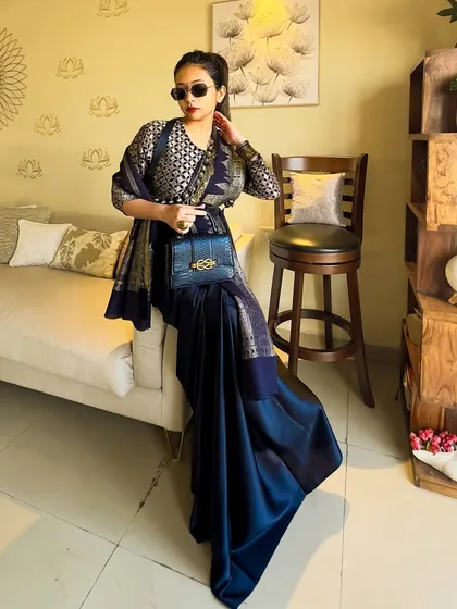 Adding a modern twist with sunglasses. This shows how you can mix contemporary accessories with traditional Indian wear to create a unique fusion style.