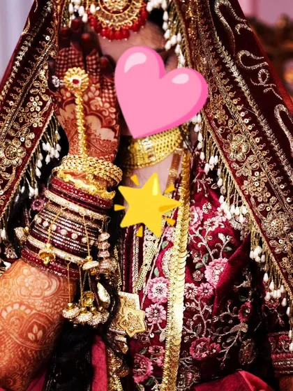 A lovely portrait of the bride, with her hand delicately placed, showing off the beautiful henna work.