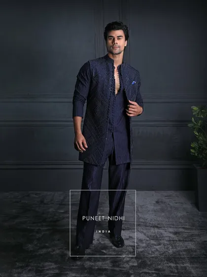 Step into the world of elegance with my bespoke Indo-fusion attire, where Indian traditions meet modern luxury, crafted to perfection for the discerning gentleman.