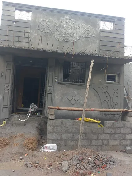 A full view of a house elevation featuring a Ganesha mural I created. My work is designed to be the main feature of a building's exterior.