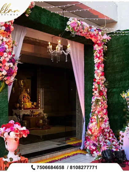 A beautiful floral archway at the entrance of a home, decorated in shades of pink. This is a wonderful way to welcome guests for an intimate pre-wedding function.