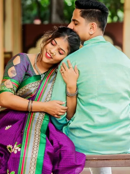 A quiet moment of comfort and affection. I love incorporating traditional elements, and this shot, with her resting on his shoulder on a classic wooden swing, feels both timeless and deeply personal. It’s a beautiful example of a Maharashtrian pre-wedding theme.