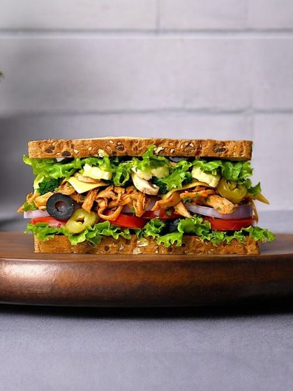 This is our Vietnamese Barbecue Chicken Sandwich, a true flavor adventure. It's loaded with smoky chicken, crisp veggies, and a tangy sauce that will transport your taste buds. Get it for just ₹99 for a limited time.