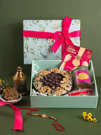 A lovely floral-themed gift box for Raksha Bandhan. I included a rakhi and a traditional lantern to add cultural context and a festive touch to the product shot.