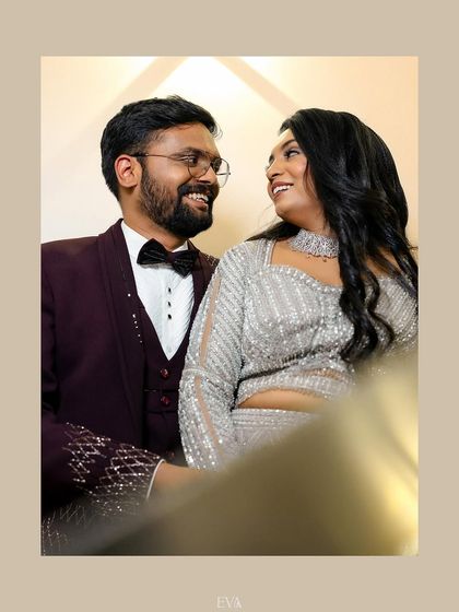 The couple shares a laugh in this candid and joyful reception portrait.