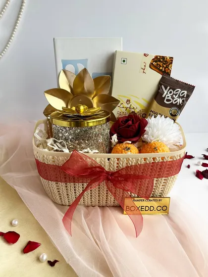 An elegant Diwali gift basket featuring a stunning crystal-studded jar and other curated items. This hamper is designed to make a lasting impression on your recipients.