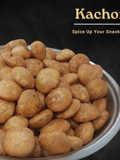 Spice up your snack time with our homemade Kachoris. These deep-fried pastries are filled with a savory mix of lentils and spices, making them a perfect companion for your evening chai.