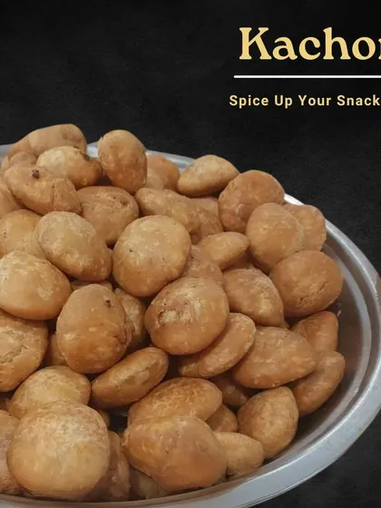 Spice up your snack time with our homemade Kachoris. These deep-fried pastries are filled with a savory mix of lentils and spices, making them a perfect companion for your evening chai.