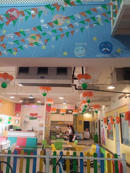 A wide view of our cafe area decorated for Independence Day. The tri-color pennants and balloons created a vibrant and patriotic setting for families to enjoy.