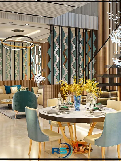 This design for an open-plan living area features a stylish partition to create a visual separation from the dining space. The round dining table and elegant chairs complement the modern aesthetic of the room.