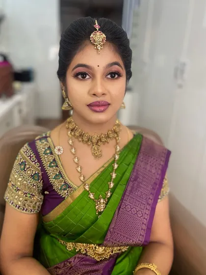 Another portrait of my friend, showcasing her party makeup. The look is designed to be vibrant and long-lasting for a full day of celebrations.