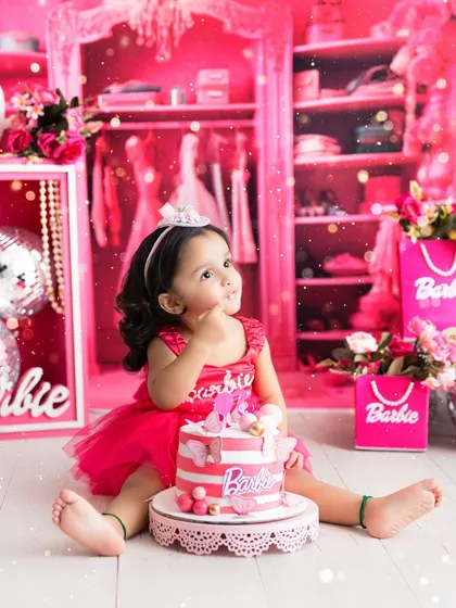 Welcome to the Barbie dream world! This vibrant, all-pink cake smash session is perfect for your little fashionista, complete with a themed cake and a closet full of dreams.