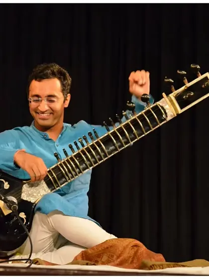 A joyful expression during a recital at the IIC in Delhi. My goal is to connect with the audience and share the bliss of Indian classical music.
