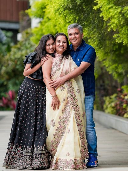 A warm and loving portrait of a family of three. We aim to capture the natural affection and happiness in our family sessions.