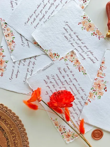 The process begins with your words, which I carefully pen onto hand-painted, deckled-edge paper. This set features soft, earthy florals to complement the rustic theme.