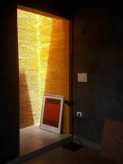 A moment captured in my studio, where a sliver of intense, yellow light from a skylight cuts through the dark interior. This image embodies my fascination with light as a primary architectural material. The way it interacts with texture and color can transform a simple space into a profound experience.
