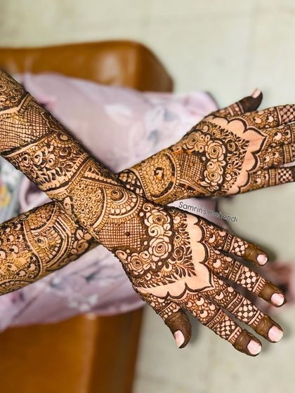 A beautiful design for an engagement or 'baat pakki', with intricate patterns covering the hands and forearms.