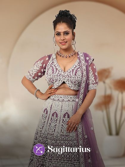 Sagittarius, your adventurous spirit loves a unique look. This purple and white lehenga with a modern cut is perfect for your free-spirited style.