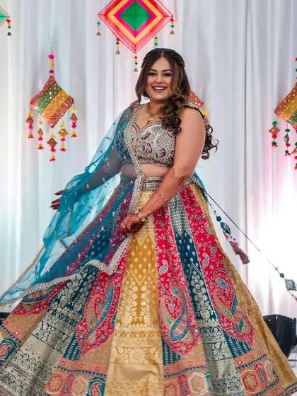 A bride's happiness is the final touch to any look. For this sangeet, I created a full glam look with defined eyes and flowing curls that moved beautifully as she twirled, perfectly matching the joyous and colorful celebration.