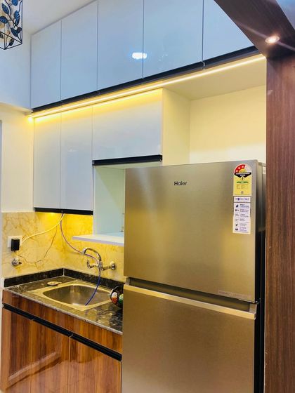 This angle shows how we planned the kitchen layout to accommodate a large refrigerator next to the sink area for a practical work triangle.