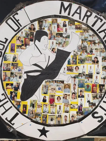 Our school is built on the spirit of our students. This custom logo, featuring photos of our members and designed by one of our black belts, represents the strong community and family we have built together over the past two decades.