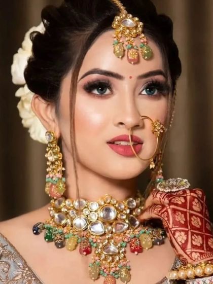 A unique Navratan-style Polki necklace with multi-colored stones. This is a vibrant and colorful option for a mehendi or sangeet ceremony.