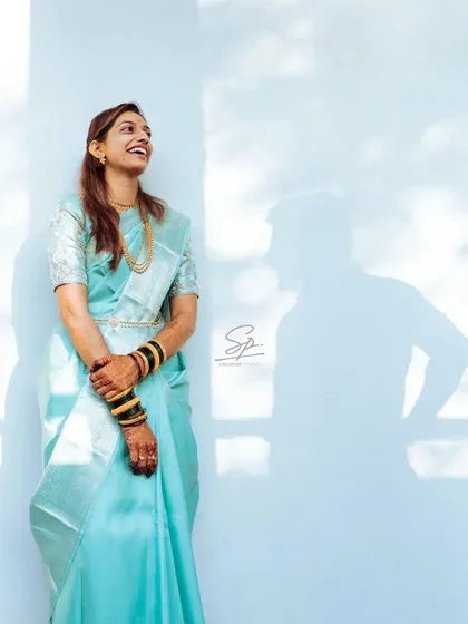 A creative take on a portrait, where the joy on her face is mirrored by the playful shadow of her partner. I use natural light and creative compositions to add an artistic and personal touch to my engagement and couple sessions.