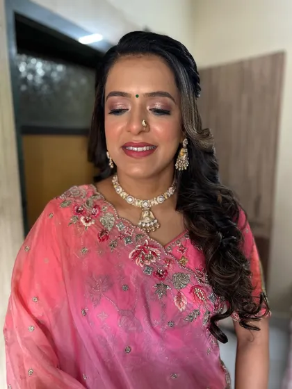 This client looks radiant in her pink saree. I created a soft glam look with a focus on glowing skin and a subtle pink lip.