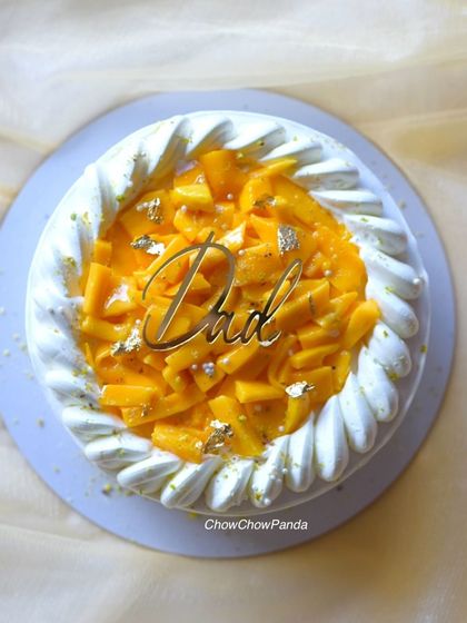 A special mango cake I made for Father's Day, topped with a "Dad" plaque.