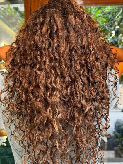 Another angle of this gorgeous head of long, colored curls. The definition and shine are consistent from root to tip.