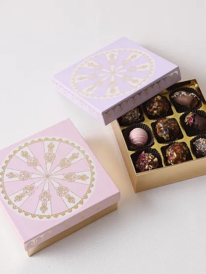 A box of our assorted festive treats, including chocolate truffles, clusters, and chocolate-covered dates. Perfect for celebrating the sweetness of Diwali.