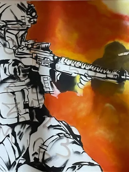 A work in progress shot of the Modern Warfare piece. You can see the stencil work and the layering of colors to create the tactical gear and fiery background.