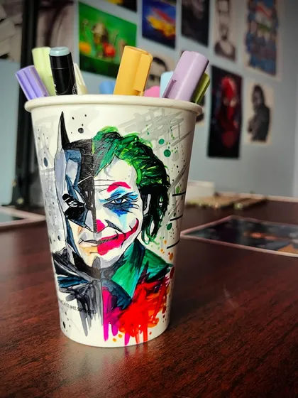 A unique commission turning a simple coffee cup into a canvas for a Batman and Joker mashup. This shows how we can get creative and make art on almost any surface you can imagine.