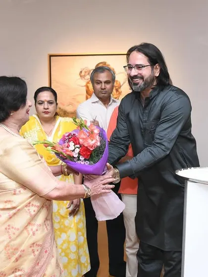 Welcoming esteemed guests with flowers at the inauguration of my exhibition. The support from the art community and patrons is what makes these shows possible and successful.