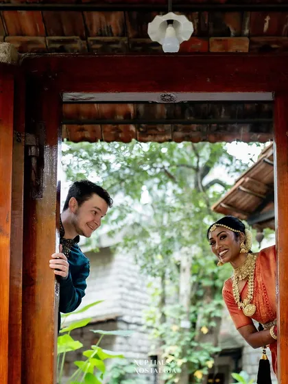 A playful peek-a-boo moment using the antique wooden doors. It’s a fun, creative way to use the venue's architectural details in your photoshoot.