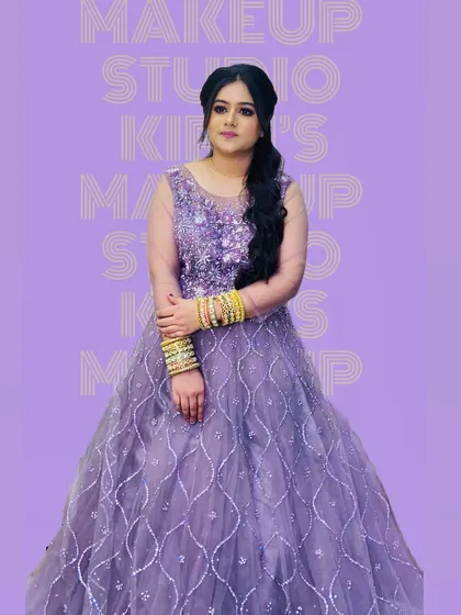 Another angle of the client in the lavender gown, showing the full effect of her party look. The side-swept hairstyle and soft makeup create a romantic and graceful silhouette.
