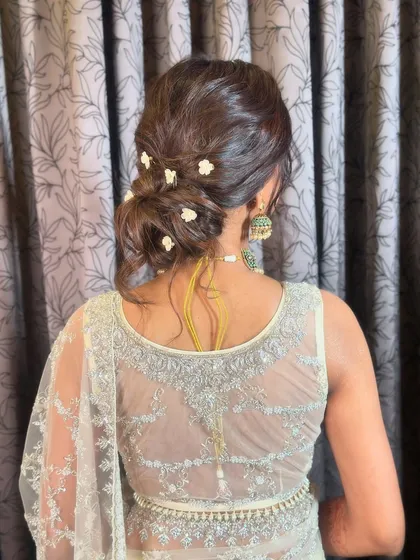 The final look, a beautiful and effortless-looking messy bun that is perfect for any special occasion.