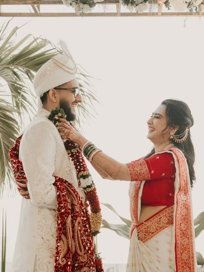A happy and playful moment during the Varmala ceremony. These are the memories that last a lifetime.