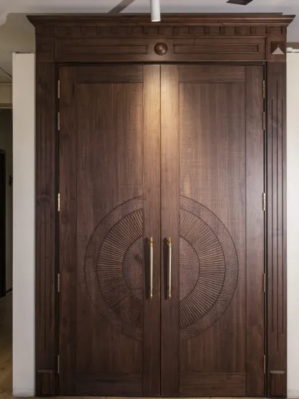 For a grand entrance, I designed this solid double door with a classic carved pattern. The rich American walnut and detailed craftsmanship give it a timeless, stately presence that speaks of pure luxury.