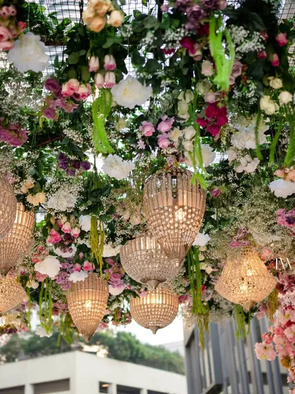 A view looking up into the dense floral arrangement of the upside down garden. We use a variety of flowers and foliage to create texture and depth, ensuring the installation is stunning from every angle.